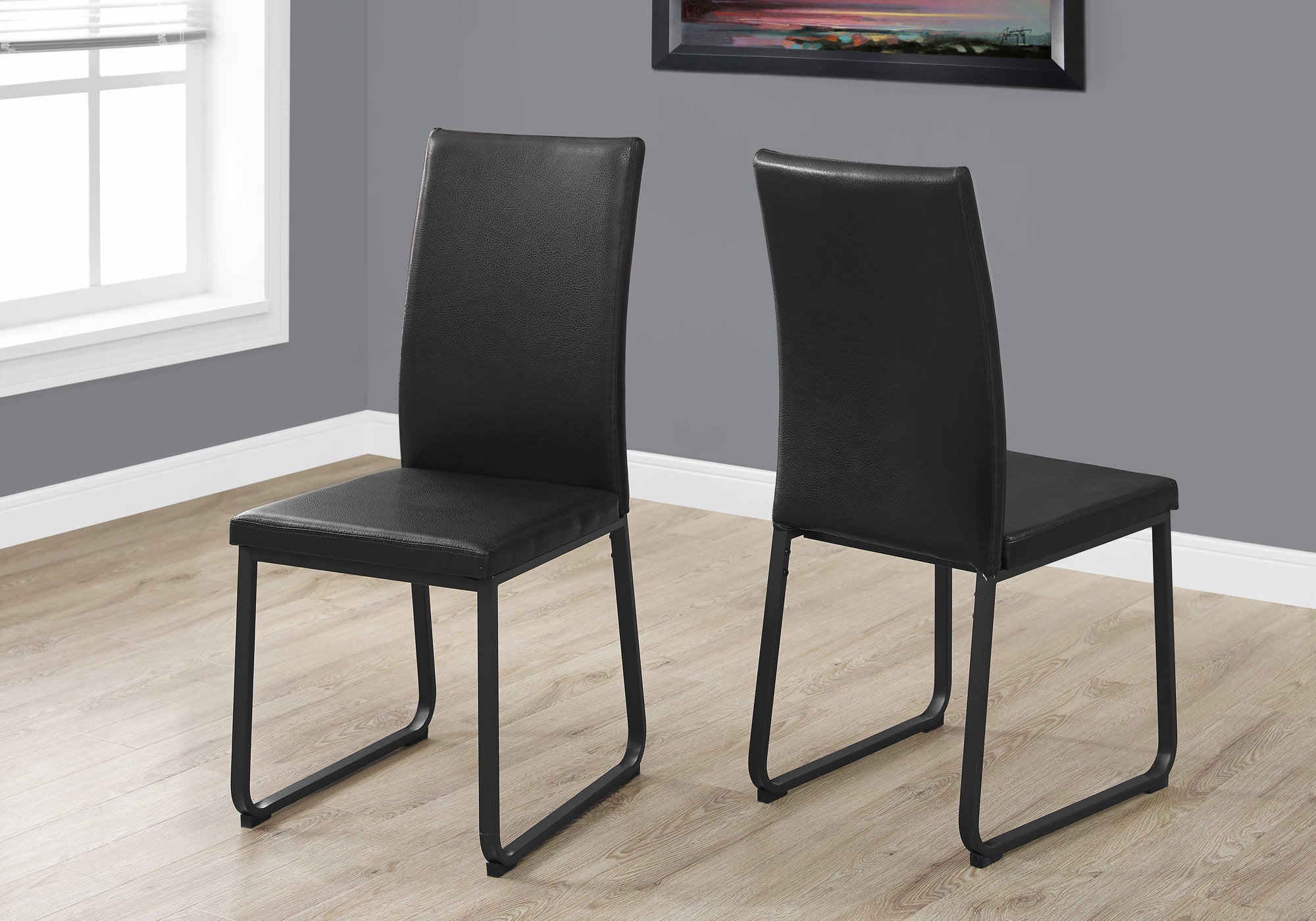 Two 38" Black Faux Leather And Metal Dining Chairs