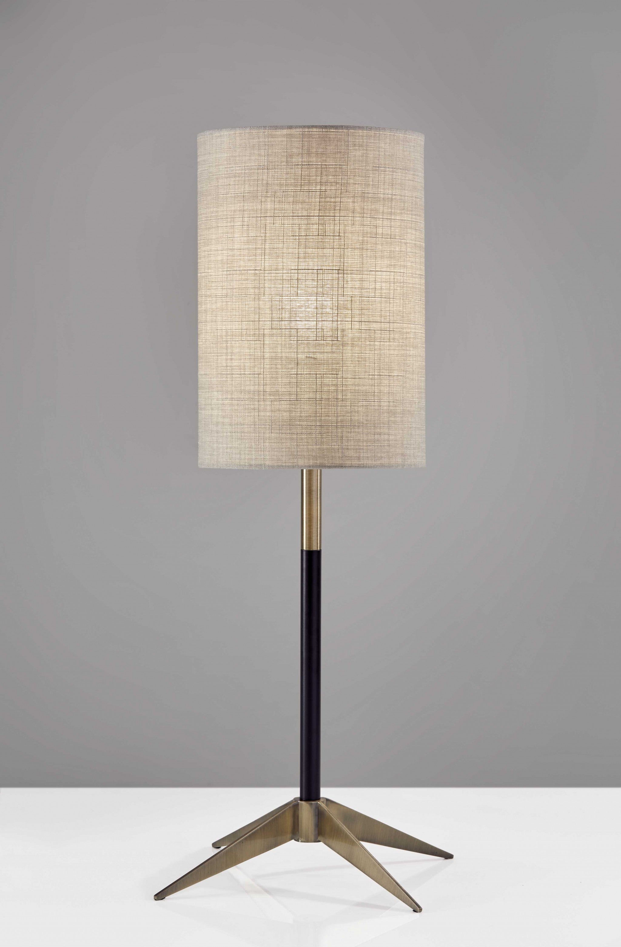 Antique Brass Metal Tripod Base With Matte Black Accent And Tall Natural Fabric Shade Table Lamp