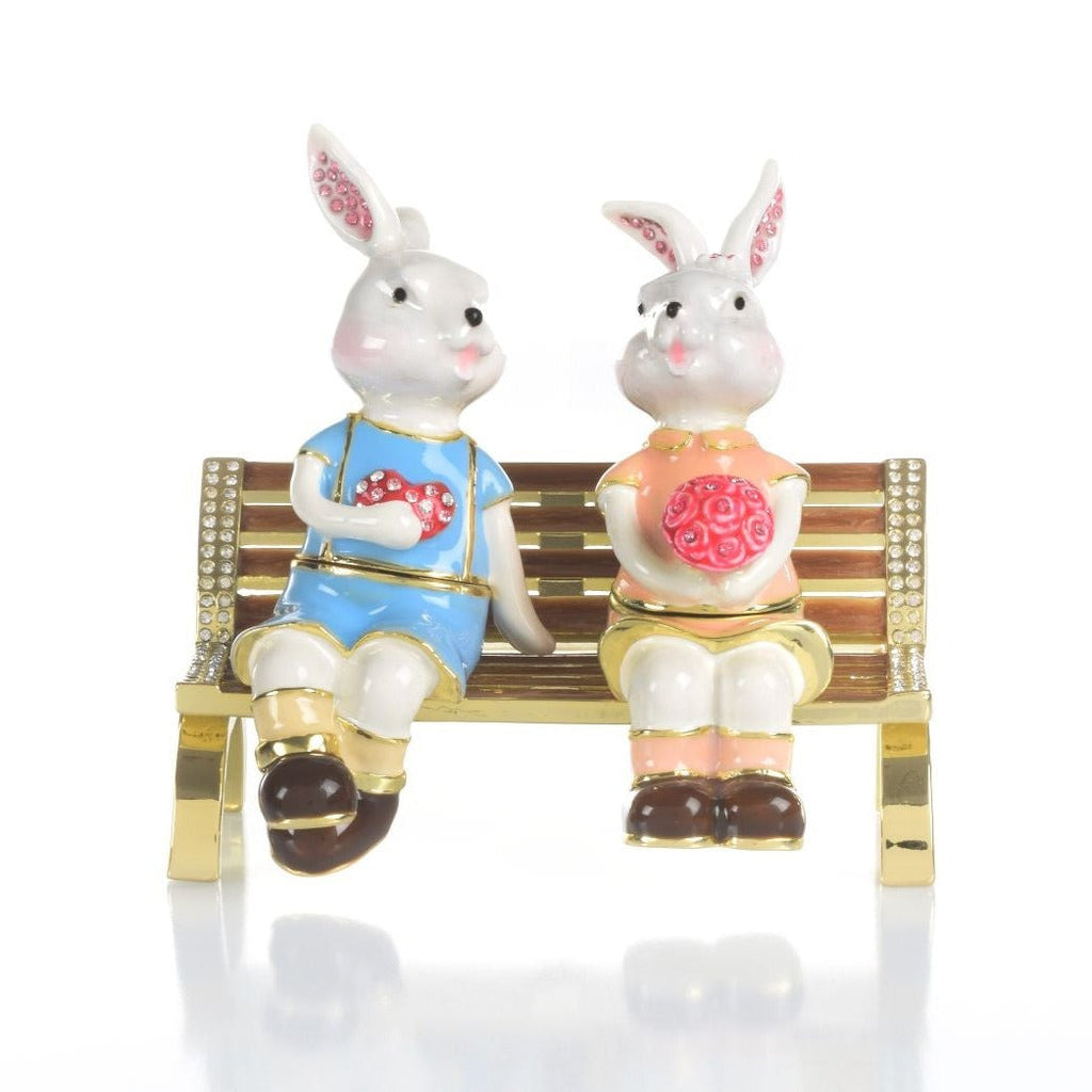 2 bunnies in love sitting on a bench, valentine flowers and chocolates - 99fab 